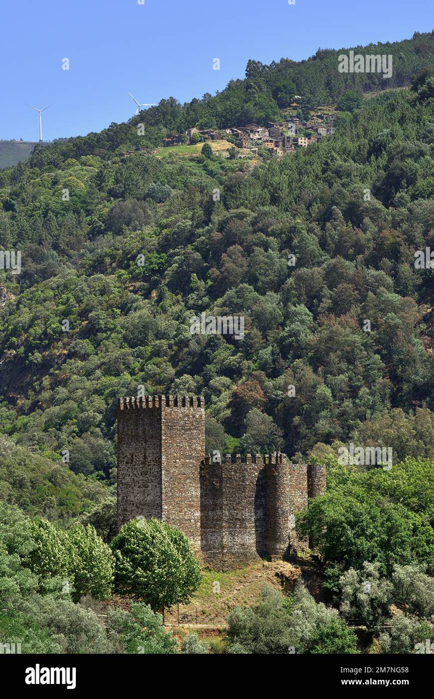 11th Century Lousa Castle, 17th Century schist village, 21st Century wind power turbines, Serra da Lousa, Portugal Stock Photo