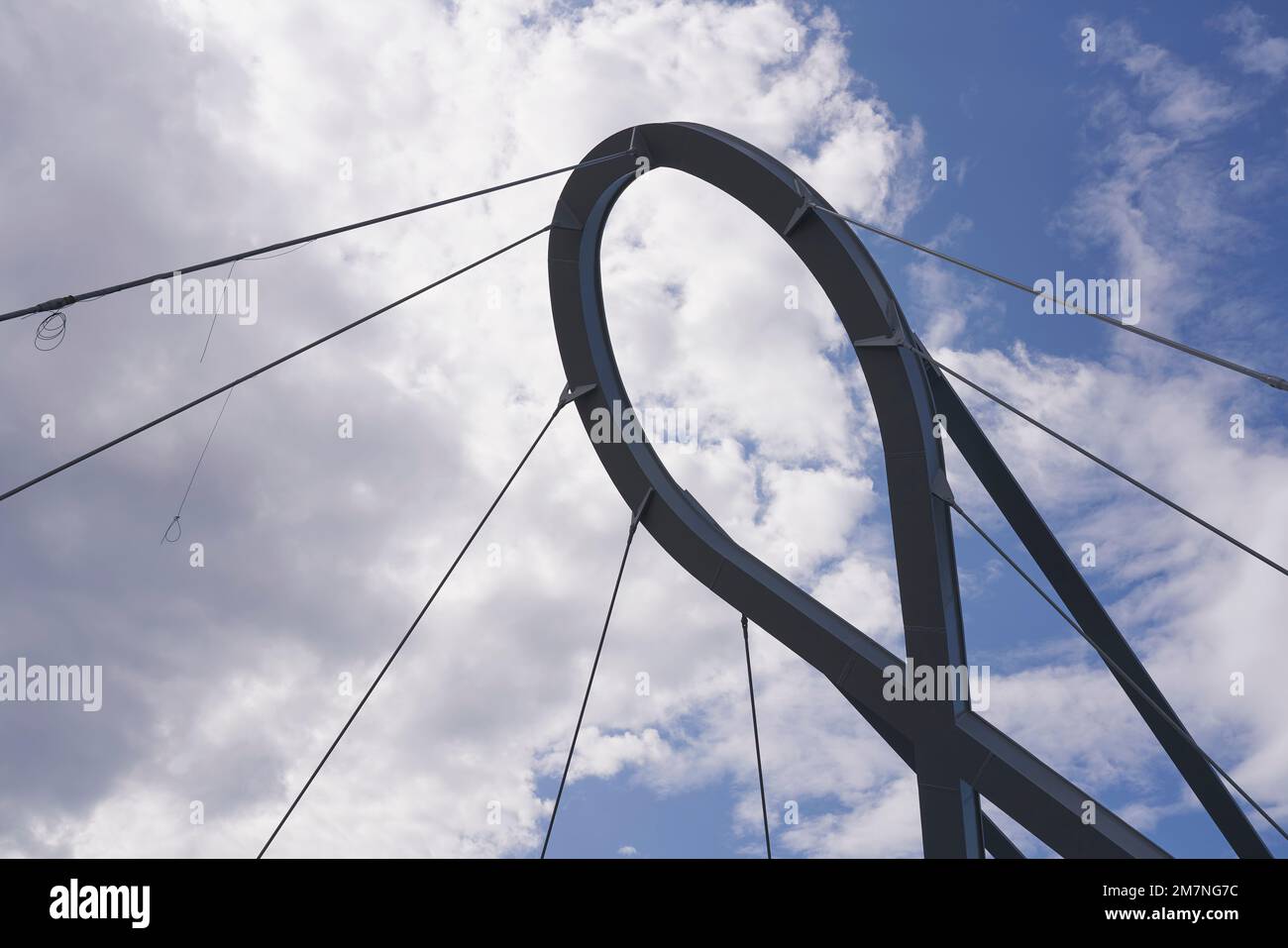 support for cable-stayed circular footbridge against cloudy sky, Aveiro, Portugal Stock Photo