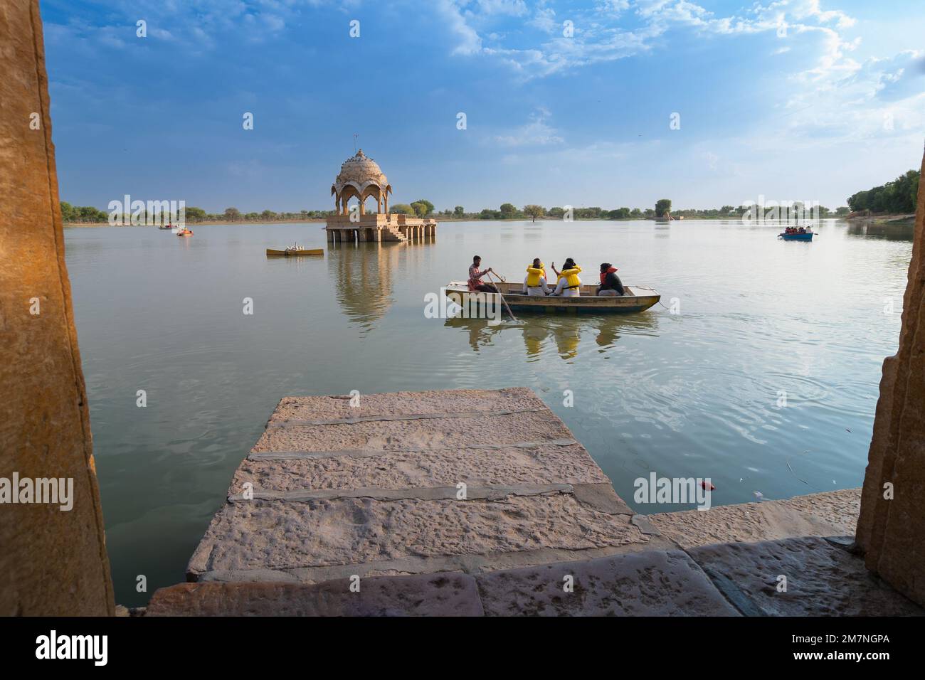 Gadisar, Jaisalmer, Rajasthan - 14th October 2019 : Tourists boating on Gadisar or Gadaria lake, built by founder of Jaisalmer, King Rawal Jaisal. Stock Photo
