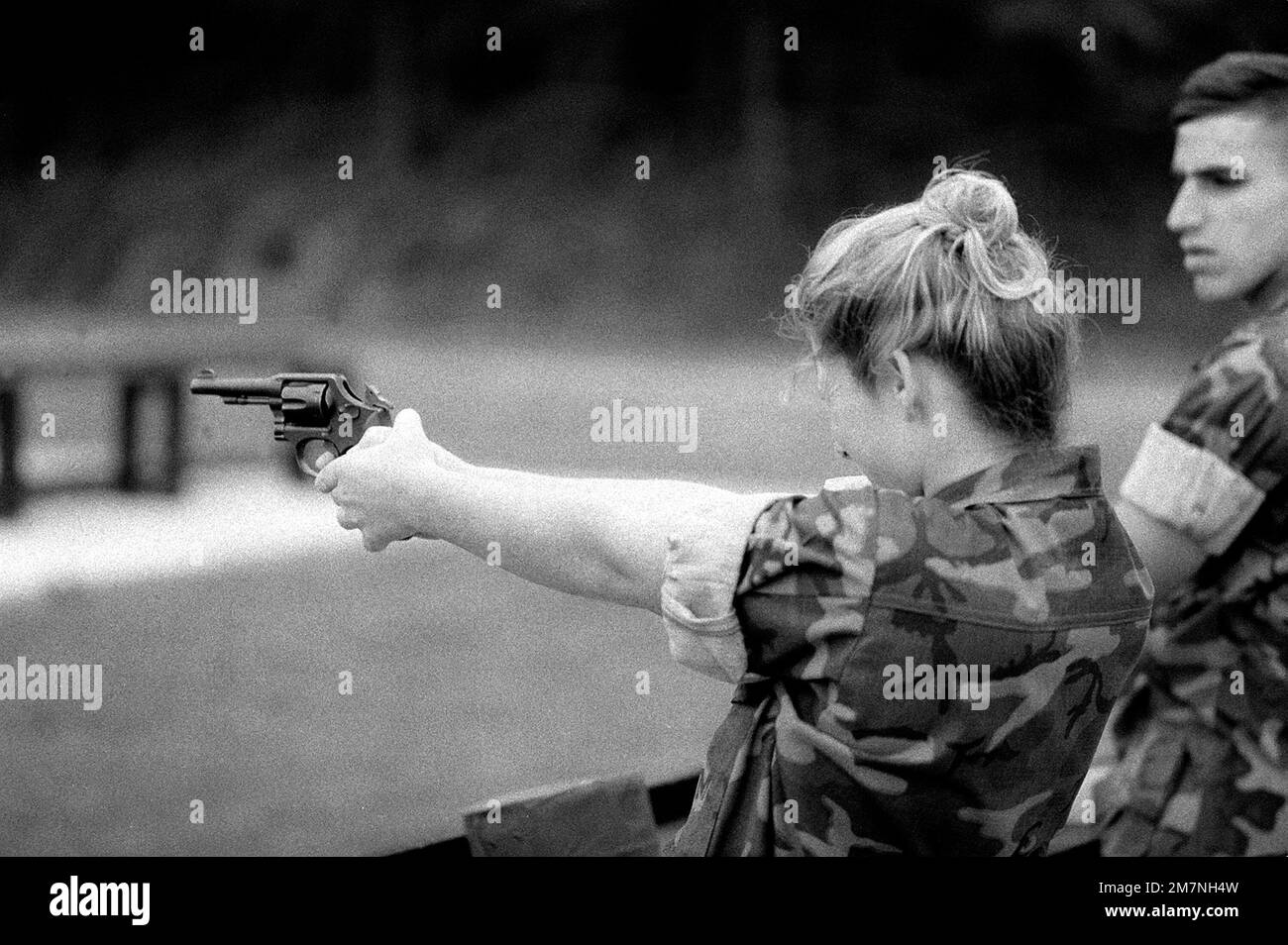 Lance CPL. Jennifer L. Hague fires a .38-caliber service revolver as part of her training at the Marine Security Guard School, Marine Corps Development and Education Command. Each Marine must qualify with the revolver before assignment to an American embassy in a foreign country. Base: Marine Corps Base, Quantico State: Virginia (VA) Country: United States Of America (USA) Stock Photo