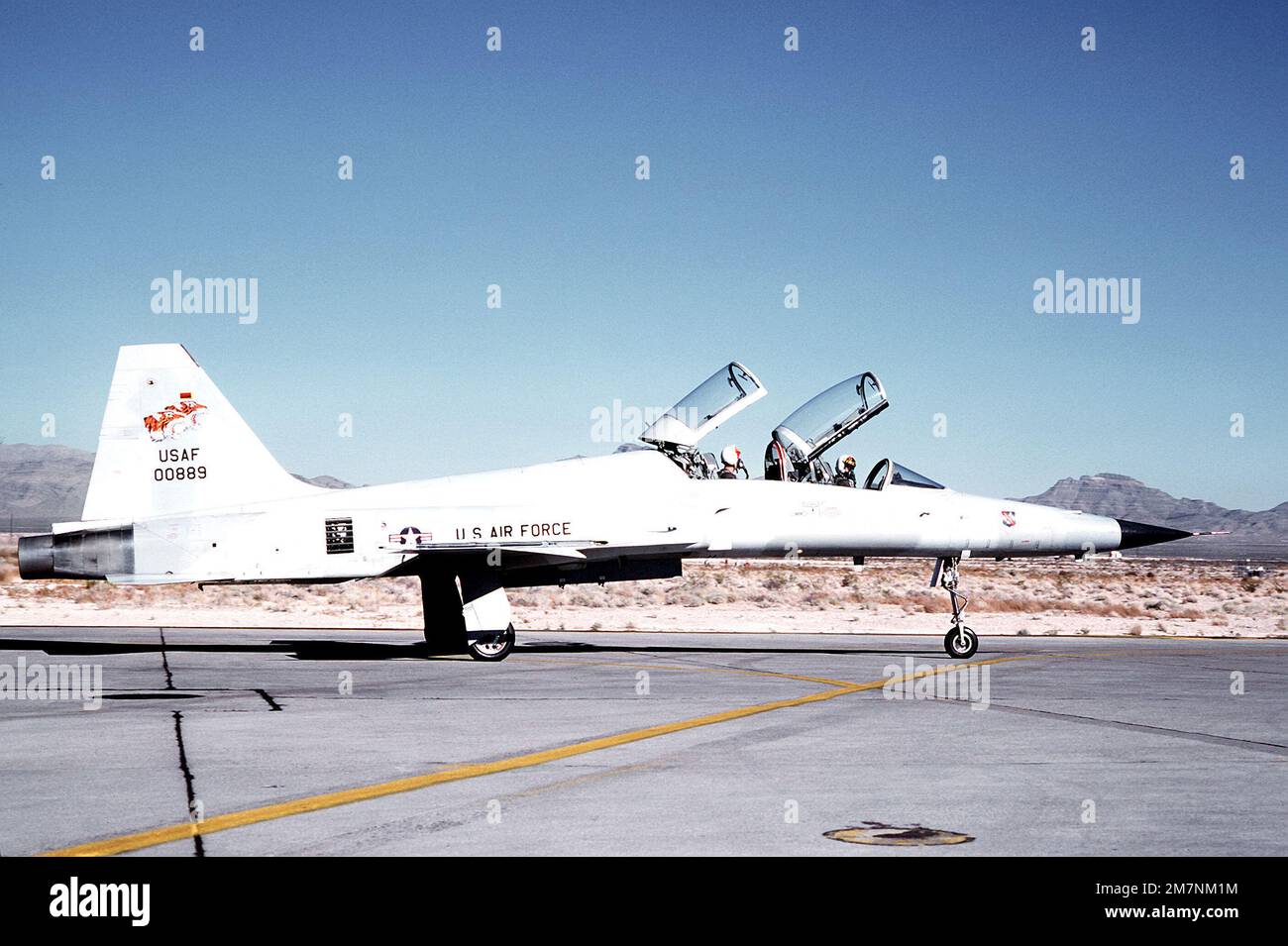 A right side view of an F5F Tiger II aircraft with its canopy raised