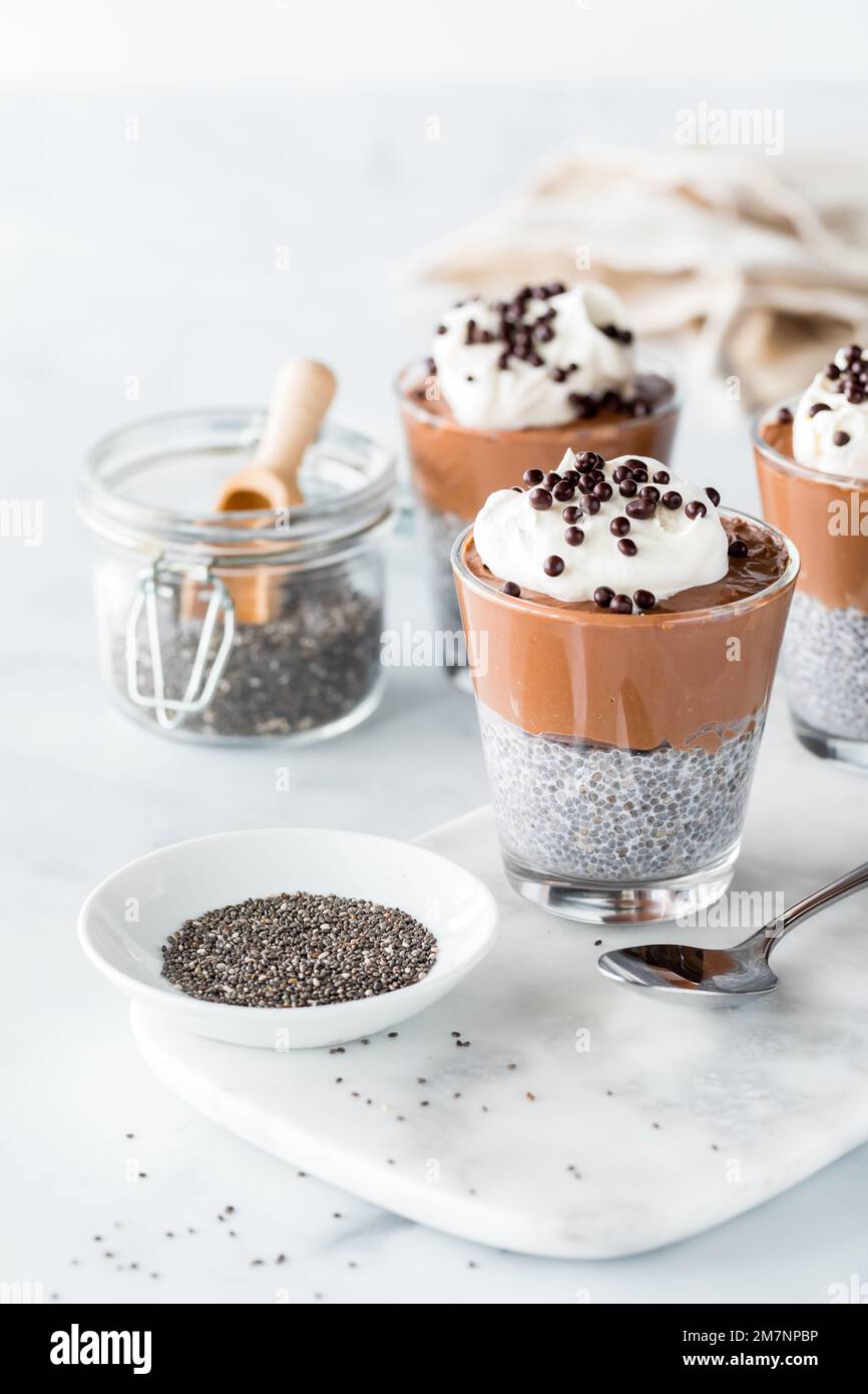 Healthy chocolate mousse chia pudding glasses, ready for eating Stock