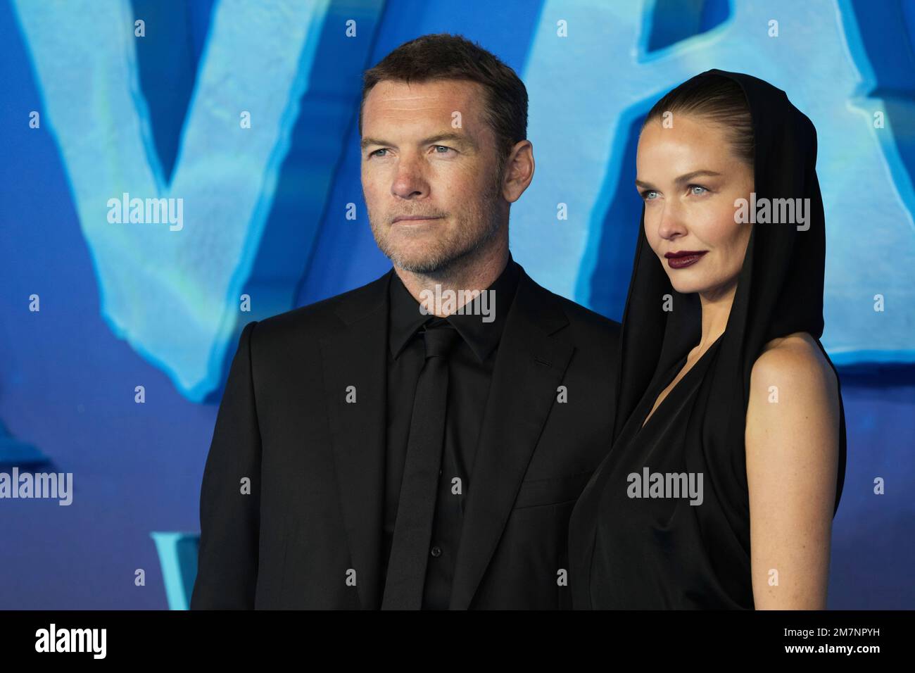 Sam Worthington, left, and Lara Worthingon pose for photographers upon ...