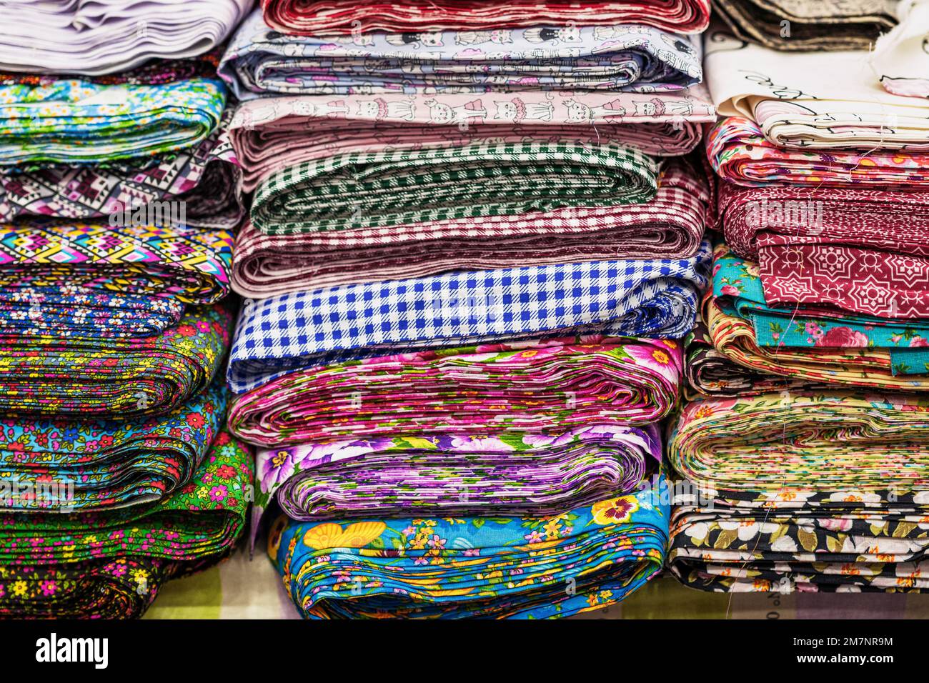 Set of fabric samples in atelier, store, factory. Sewing clothes, manufacturing, clothing