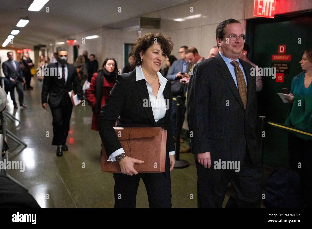 New York executive assistant district attorney Susan Hoffinger. center