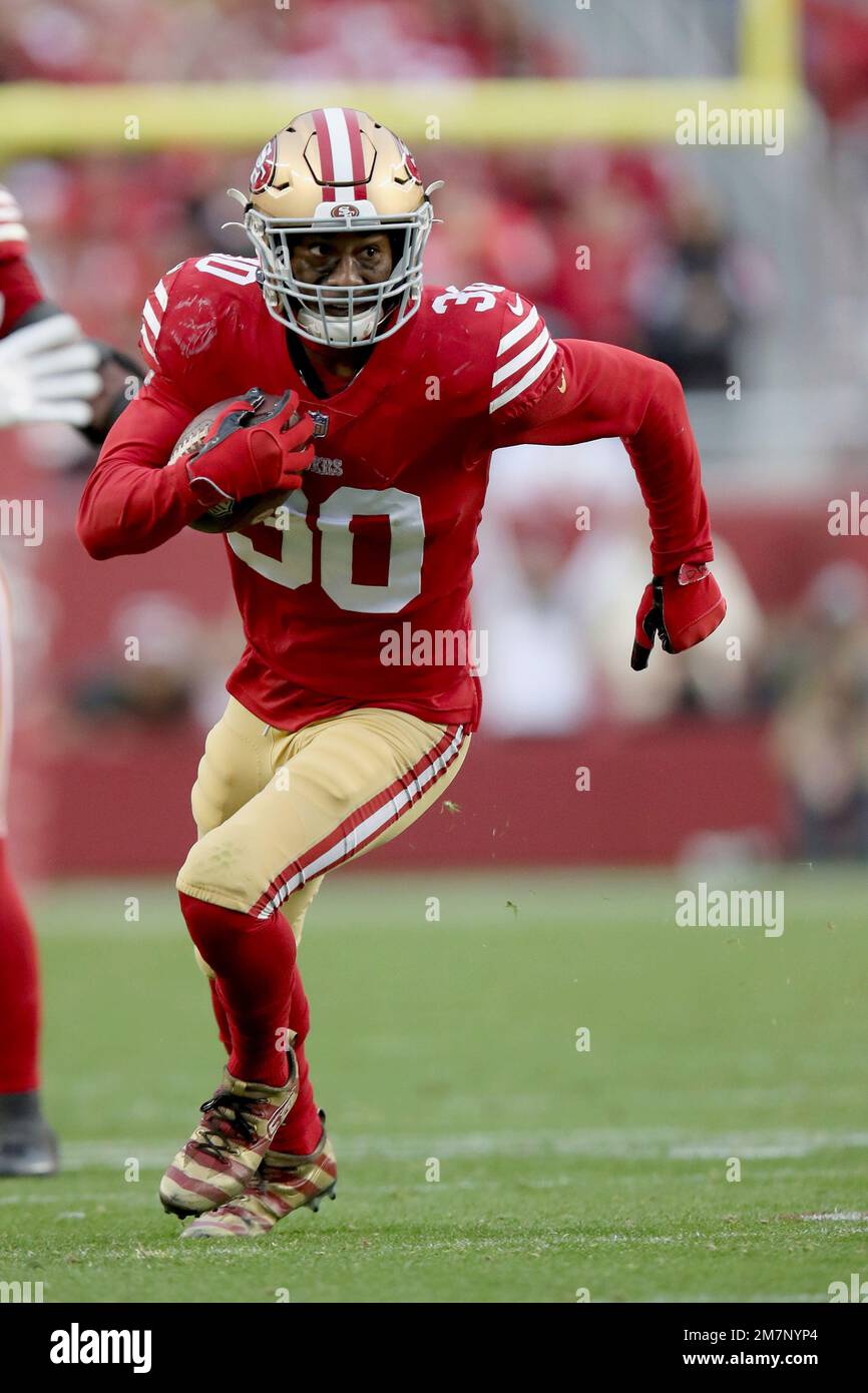 San Francisco 49ers safety George Odum (30) runs after an interception  during an NFL football game against the Arizona Cardinals, Sunday, Jan.8,  2023, in Santa Clara, Calif. (AP Photo/Scot Tucker Stock Photo 