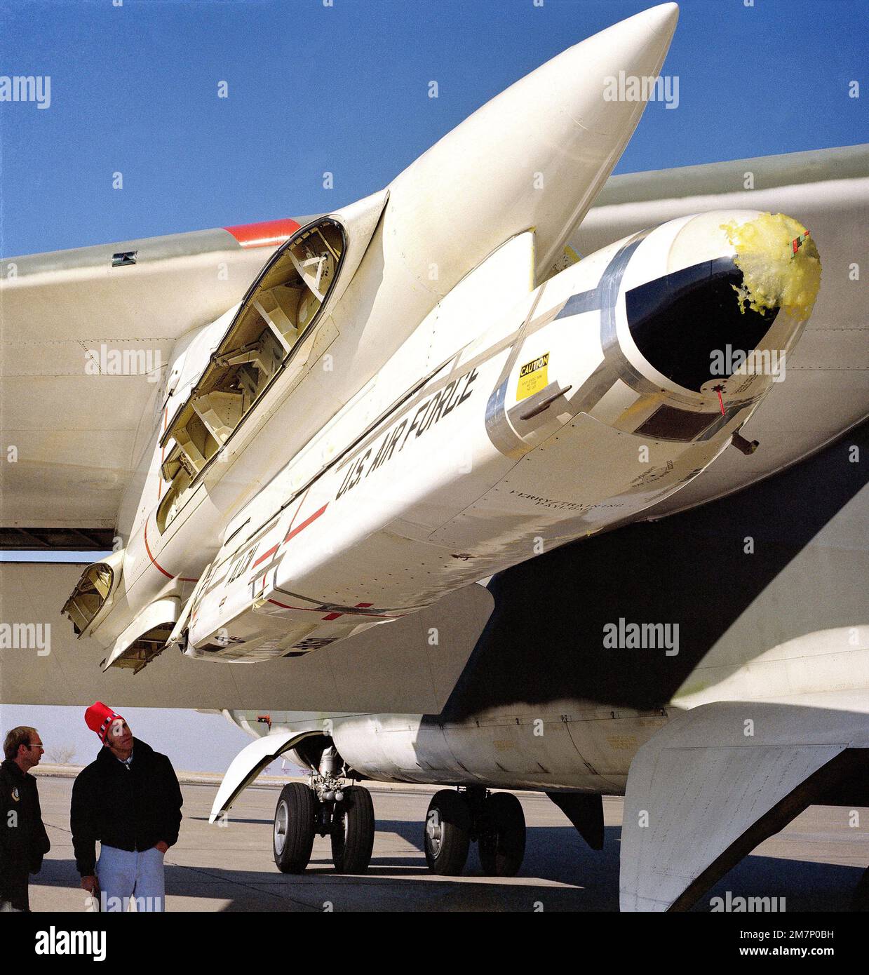 A close-up view of an AGM-86 air-launched cruise missile mounted on a B-52 Stratofortress aircraft wing pylon for an icing test mission. Base: Hill Air Force Base State: Utah (UT) Country: United States Of America (USA) Stock Photo