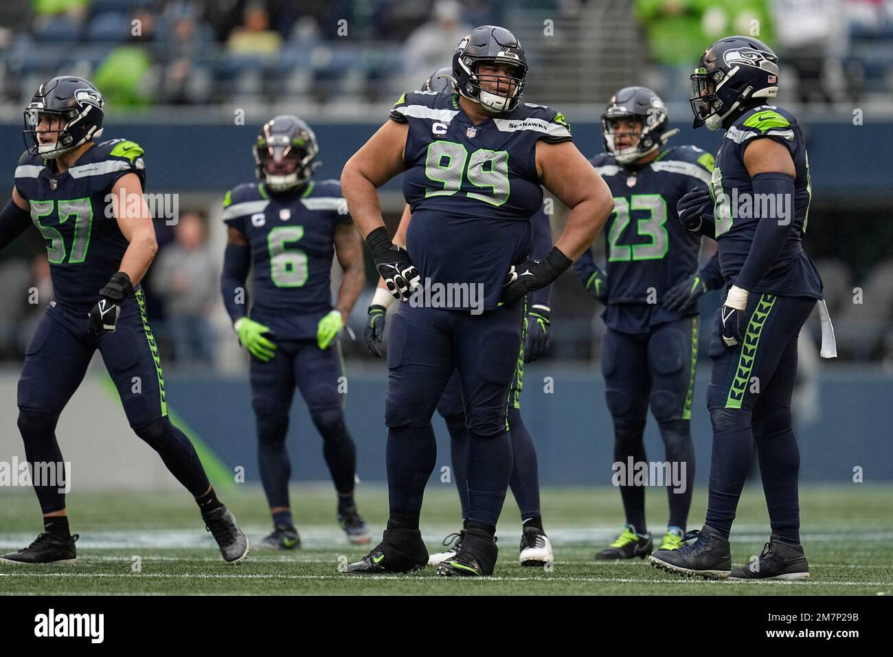 Seattle Seahawks defensive tackle Al Woods (99), middle, stands on