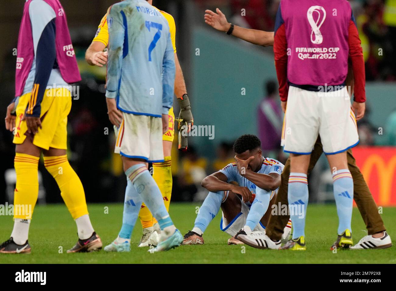 Spain's Alejandro Balde sits on the ground after the penalty shootout