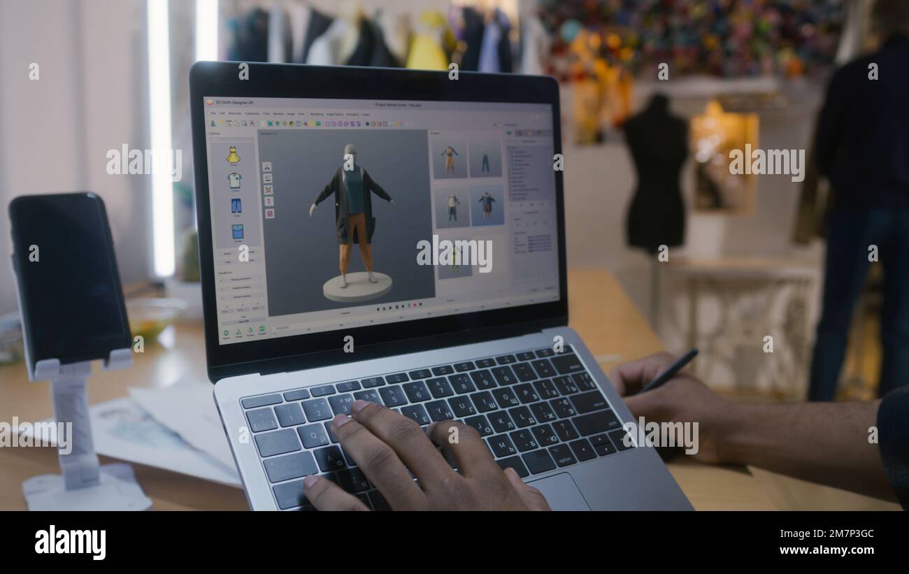 African American fashion designer creates clothes in 3D modeling