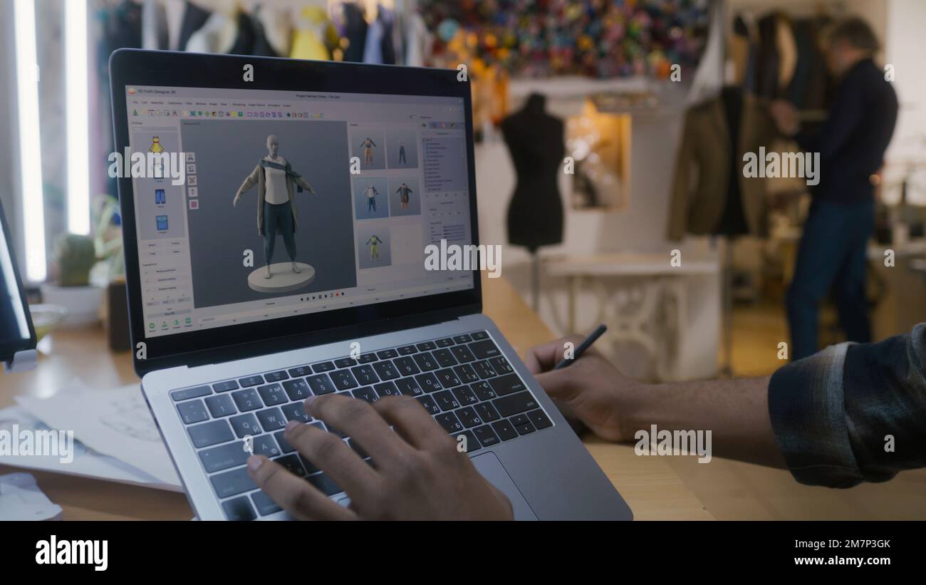 African American fashion designer creates clothes in 3D modeling