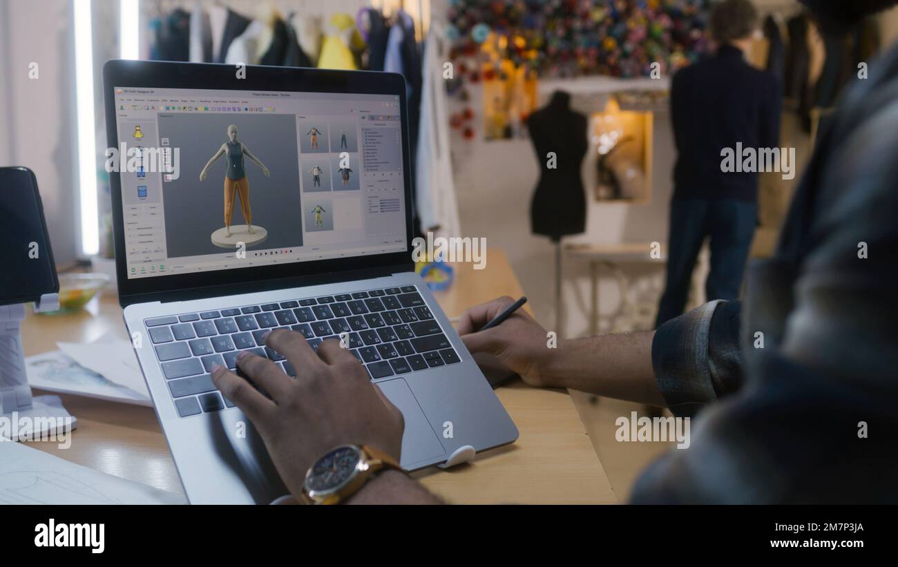 African American fashion designer creates clothes in 3D modeling