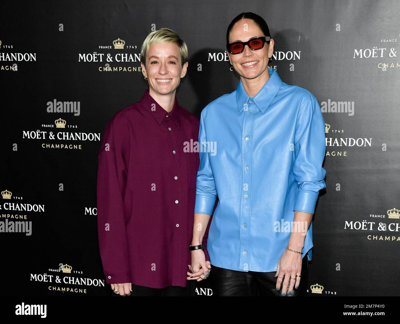 Megan Rapinoe, left, and Sue Bird attend the Moet & Chandon holiday