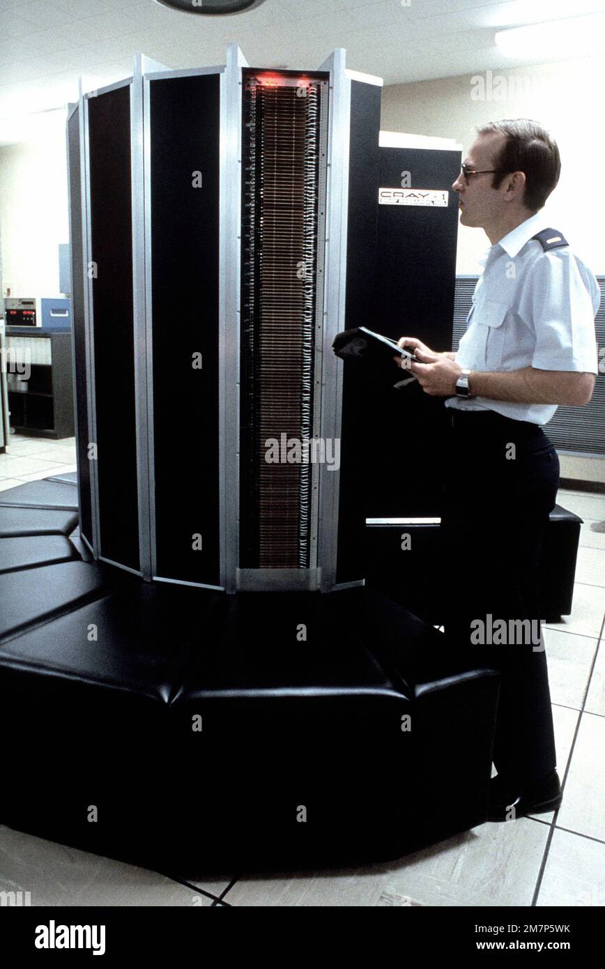 A technician works on a Cray-1 computer. Base: Kirtland Air Force Base State: New Mexico (NM) Country: United States Of America (USA) Stock Photo