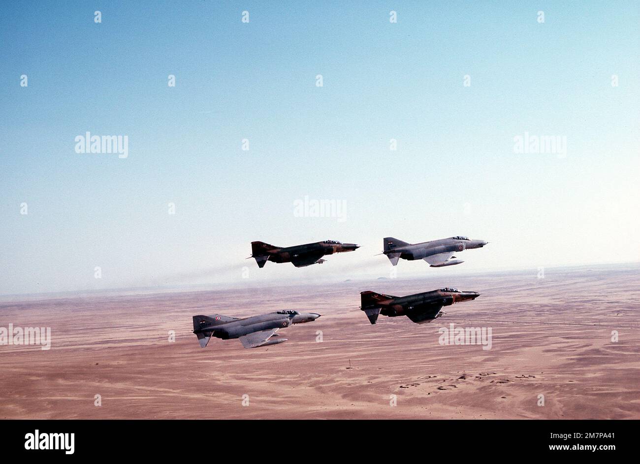 A right rear view of four F-4E Phantom II aircraft flying in formation ...