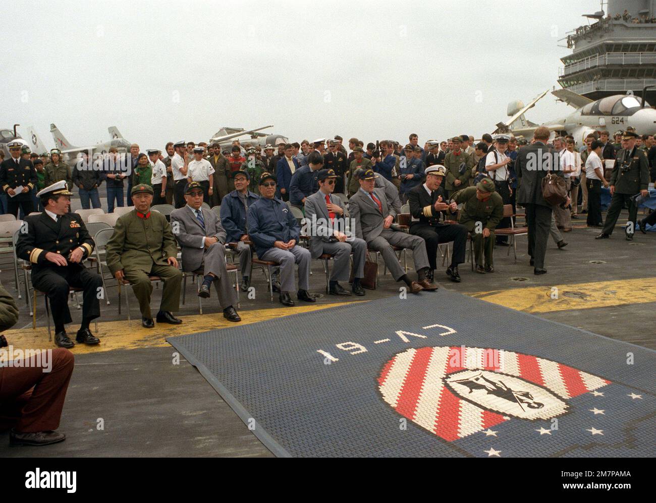 Vice Premier Geng Biao of China is seated with some members of his ...