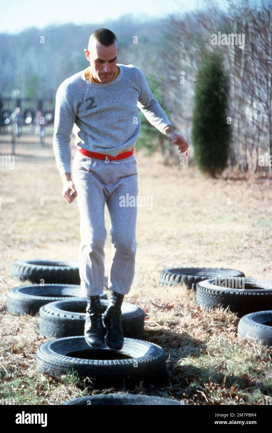 A Marine officer candidate trains on the obstacle course while