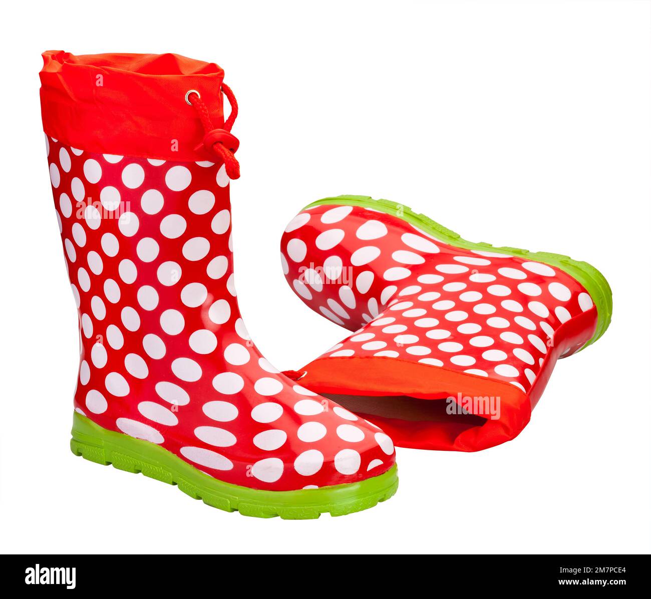 A pair of red rubber boots with white dots on a white background Stock