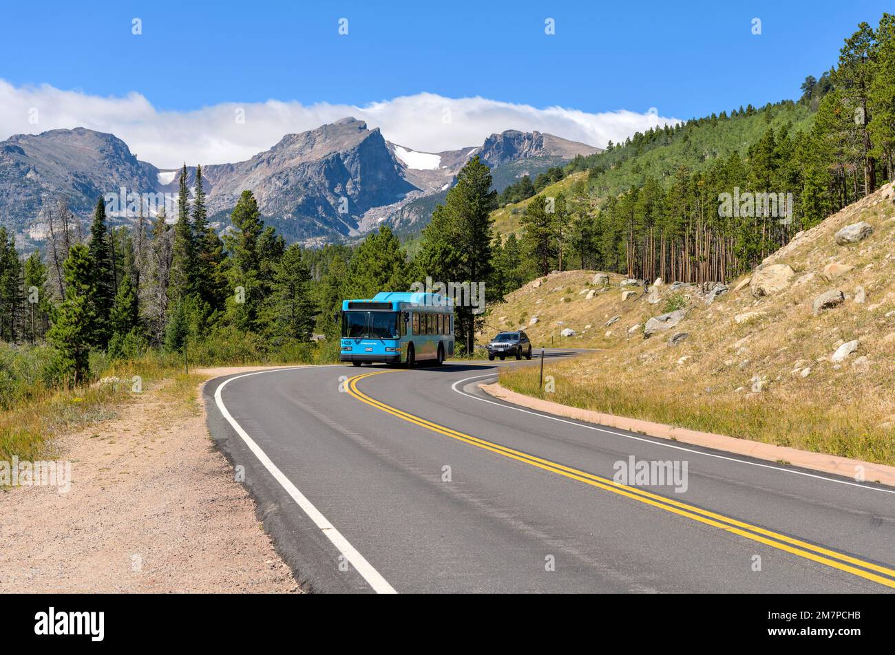 Shuttle on Bear Lake Road - During Summer and Autumn months, Shuttle buses help to reduce heavy traffic on scenic and popular Bear Lake Road, RMNP, CO. Stock Photo