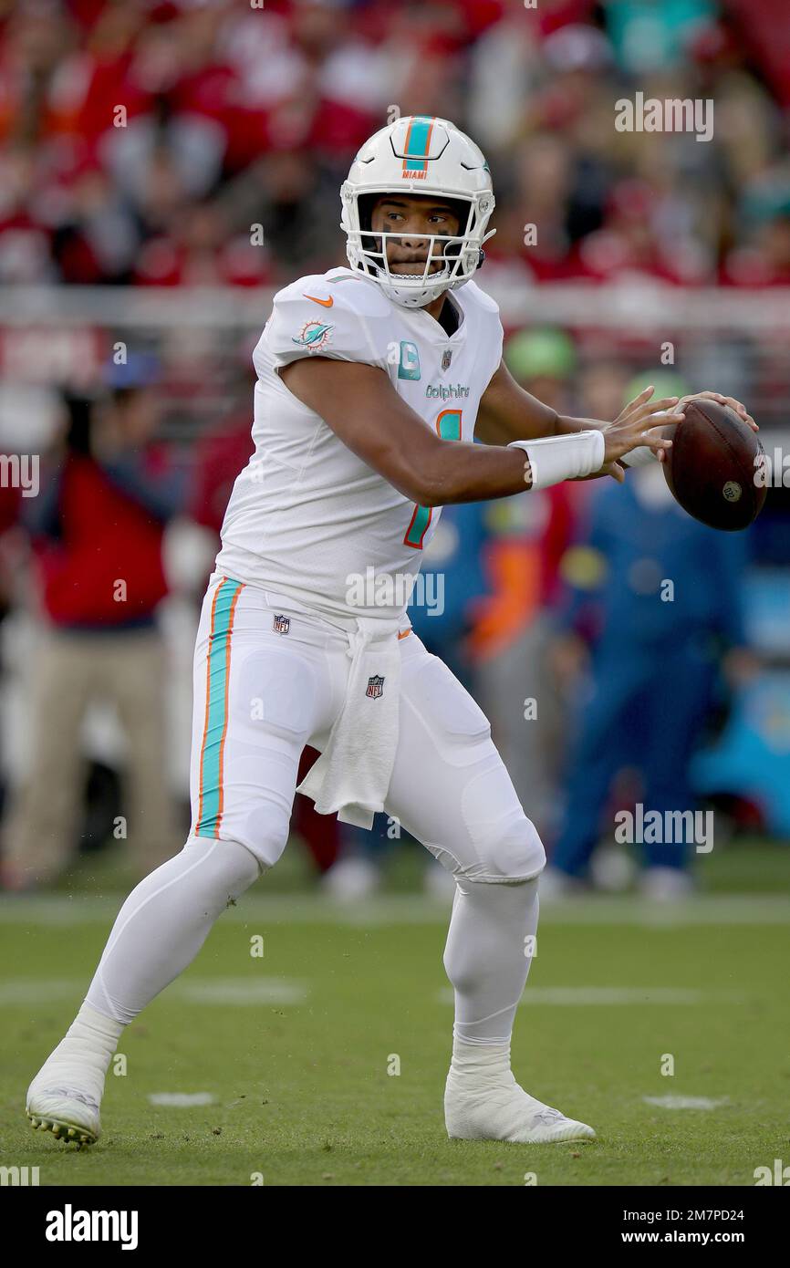 Miami Dolphins quarterback Tua Tagovailoa (1) drops back to pass during an  NFL football game against the San Francisco 49ers, Sunday, Dec.4, 2022, in  Santa Clara, Calif. (AP Photo/Scot Tucker Stock Photo 