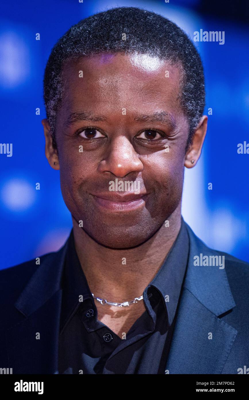 Adrian Lester poses for photographers upon arrival for 'The British