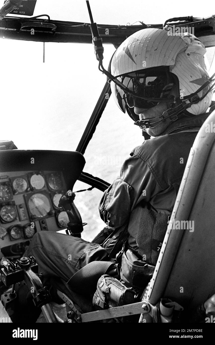 A Helicopter Pilot Mans The Controls During A Flight To Photograph 