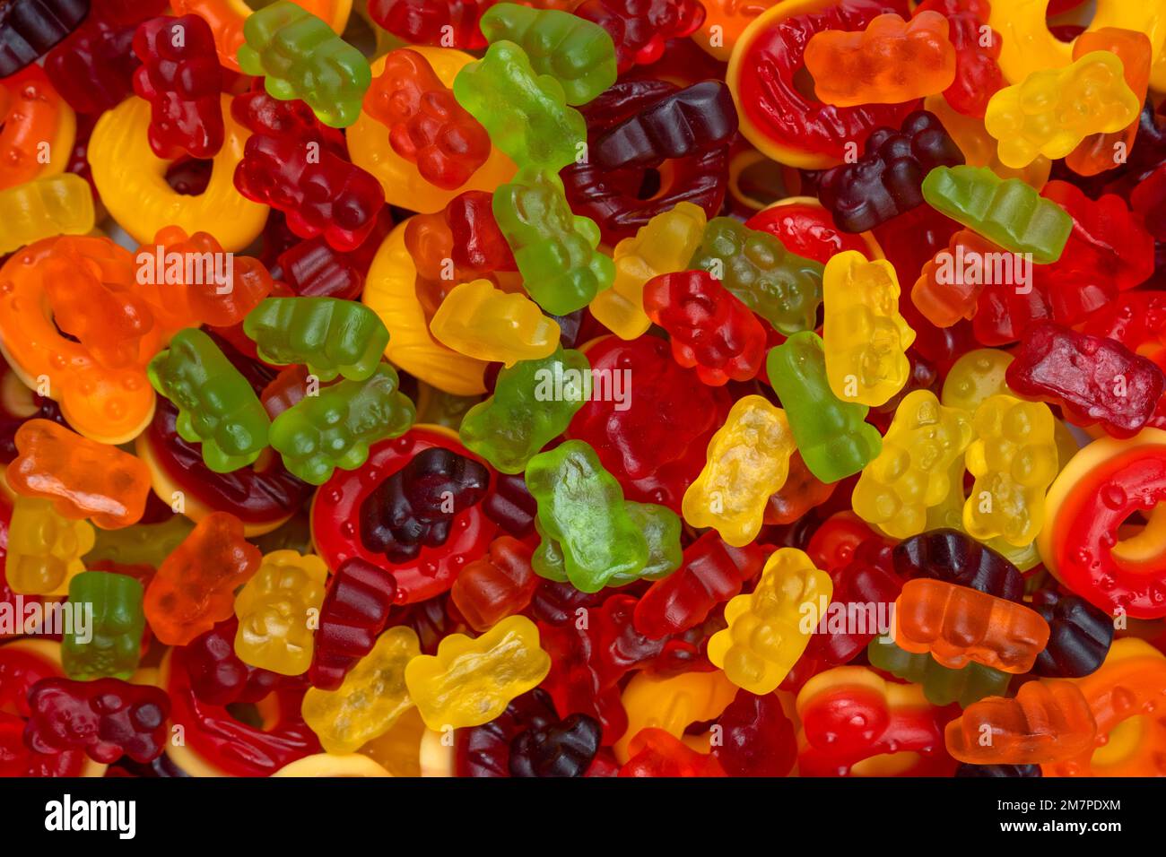 Assorted colorful gummy candies. Top view. Jelly donuts. Jelly bears. Stock Photo