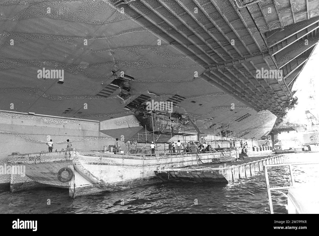 a-view-of-damage-caused-to-the-port-amidships-section-of-the-aircraft