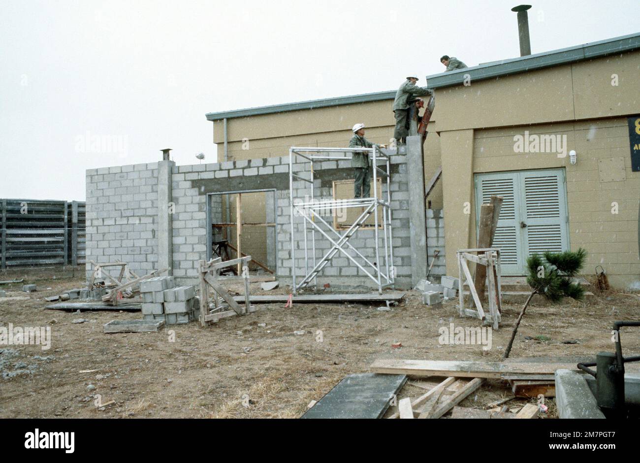 Members of the 554th Civil Engineering Squadron (Red Horse) construct a ...