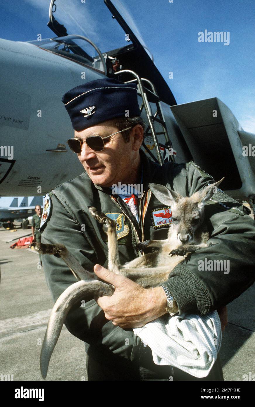 COL Bailes holds a baby kangaroo during exercise Pacific Consort ...
