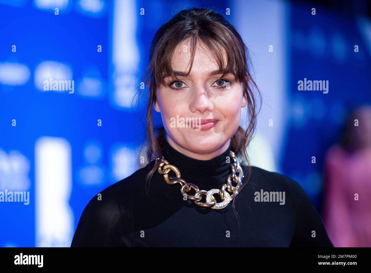 Nell Barlow poses for photographers upon arrival for 'The British