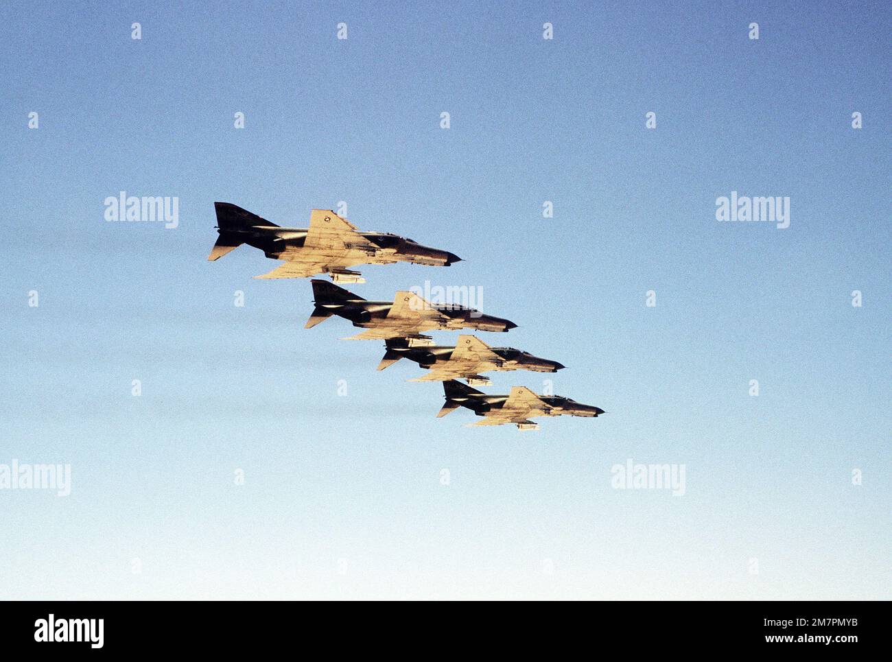 Four 70th Tactical Fighter Squadron F-4E Phantom II aircraft armed with AGM-65A Maverick missiles fly in formation during exercise Pround Phantom'80. Base: Cairo West Air Base State: Al Qahirah Country: Egypt (EGY) Stock Photo