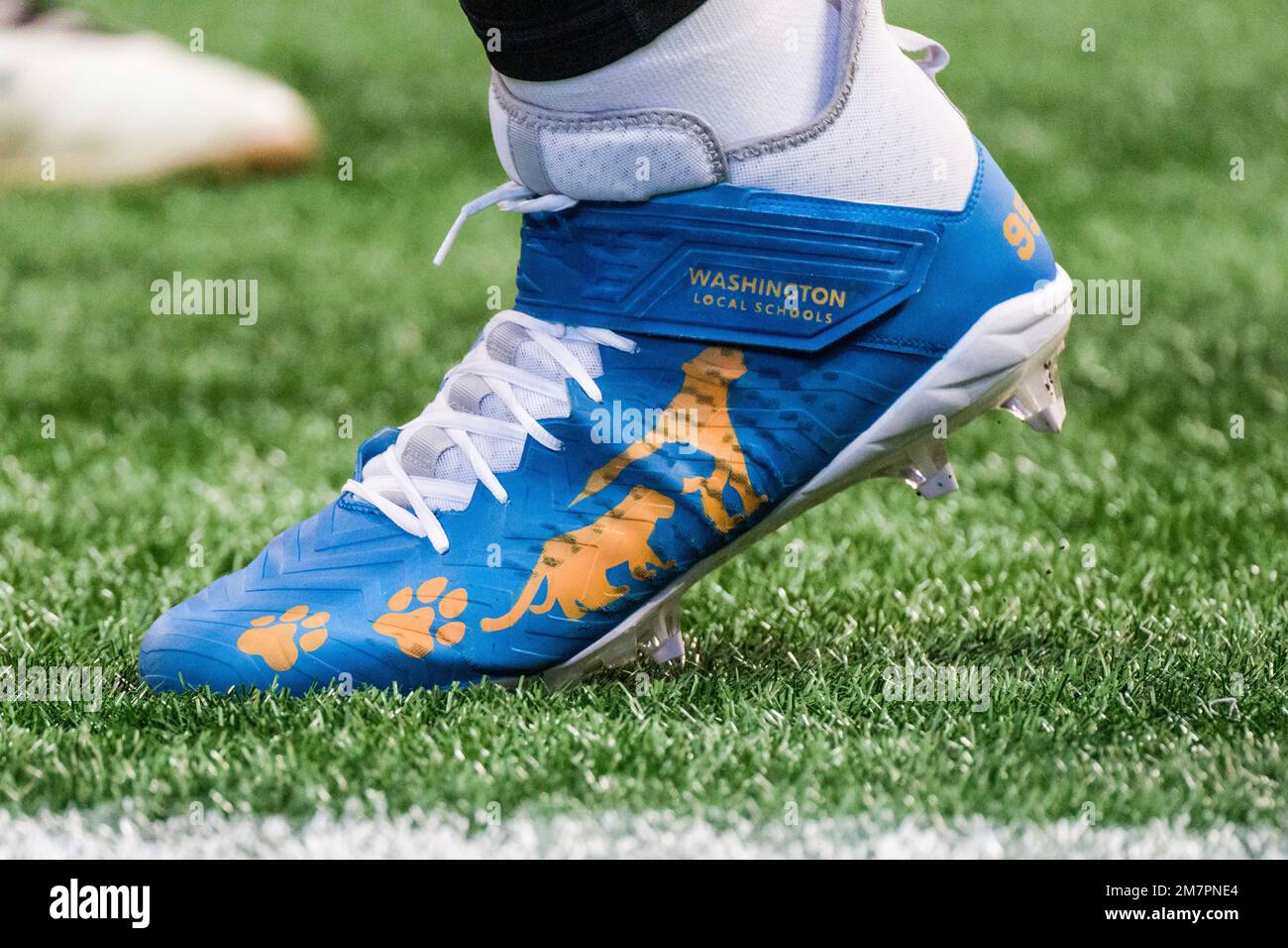 under armour orange and black cleats