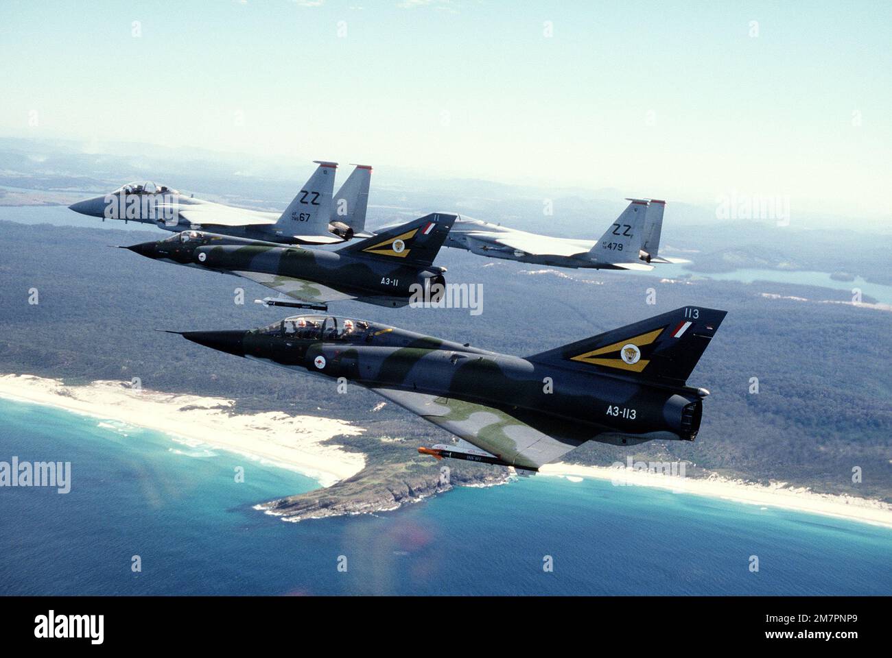 A left side view of four aircraft inflight during the joint U.S