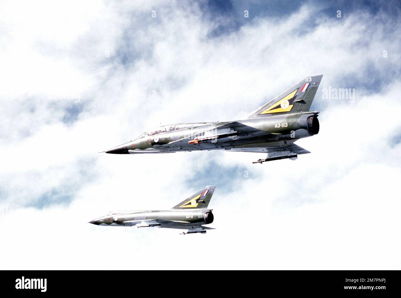 A left side view of two Royal Australian Air Force aircraft