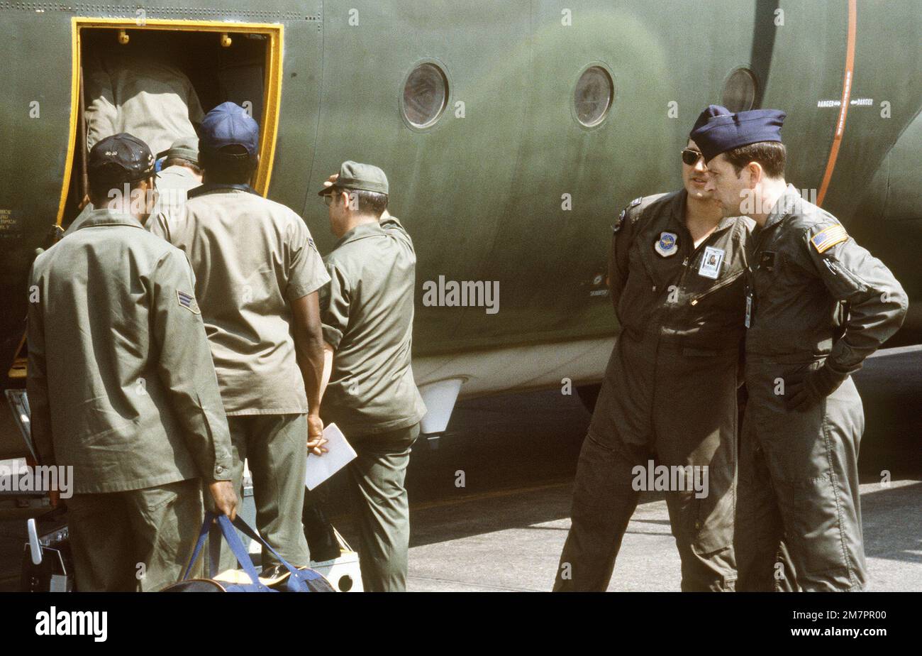 Airmen board a C-130 Hercules aircraft during exercise Purple Duck, a ...