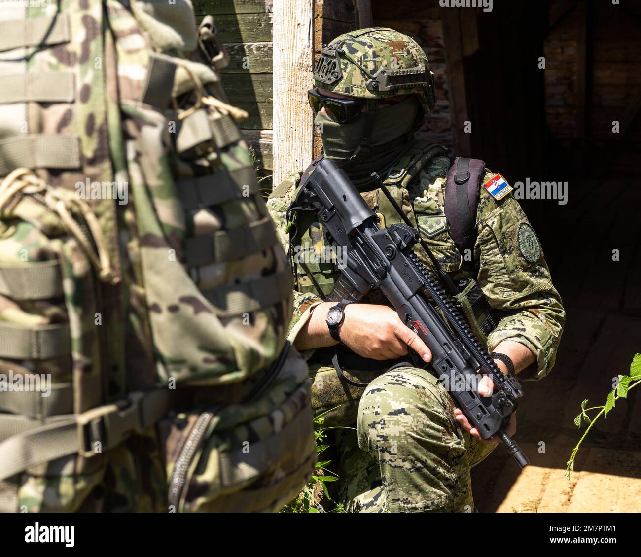A Senior Croatian Army Special Forces Joint Terminal Attack Controller (JTAC) provides guidance