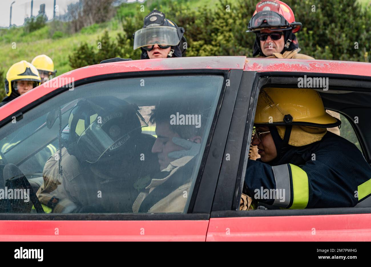 Firefighters assigned to the 65th Air Base Squadron and Portuguese air force Emergency Assistance System Operators rescue a firefighter during a simulated emergency at Lajes Field, Azores, Portugal, May 11, 2022. The 65 ABS provided internship opportunities to Portuguese air force OPSAS sergeants who have recently cross-trained into the firefighter career field. Stock Photo