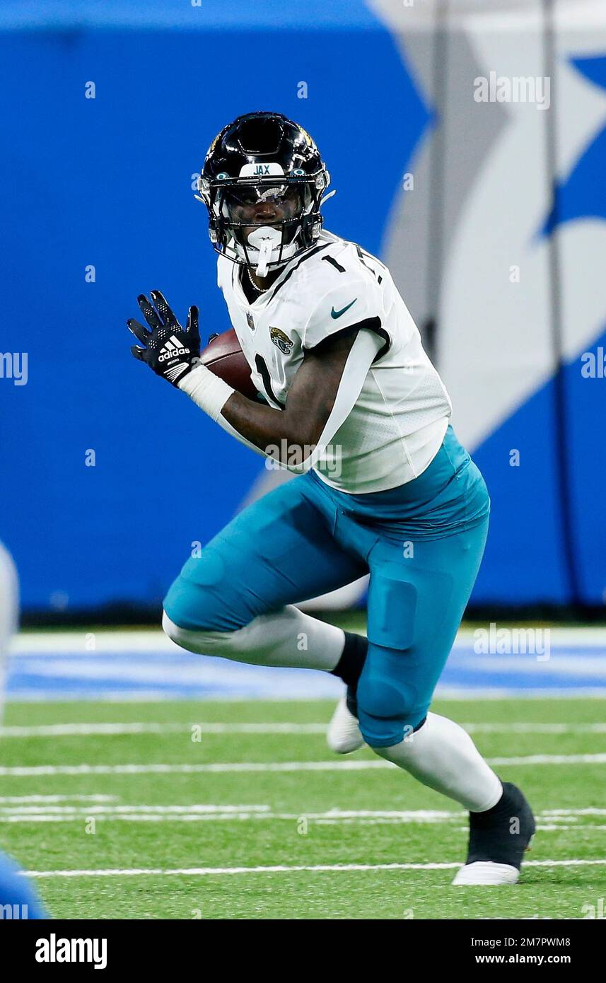 Jacksonville Jaguars running back Travis Etienne Jr. (1) carries the ball  against the Detroit Lions during