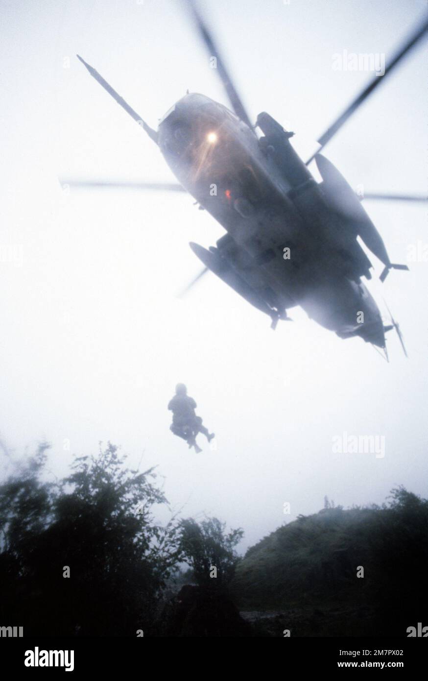 A1C Scott Gearen and Dutch 'survivor' MSGT Albert Van Rhijin are lifted aboard a CH-53 Sea Stallion helicopter during exercise REFORGER '80. Subject Operation/Series: REFORGER '80 Base: Diepoltz German Air Base Country: West Germany (FRG) Stock Photo