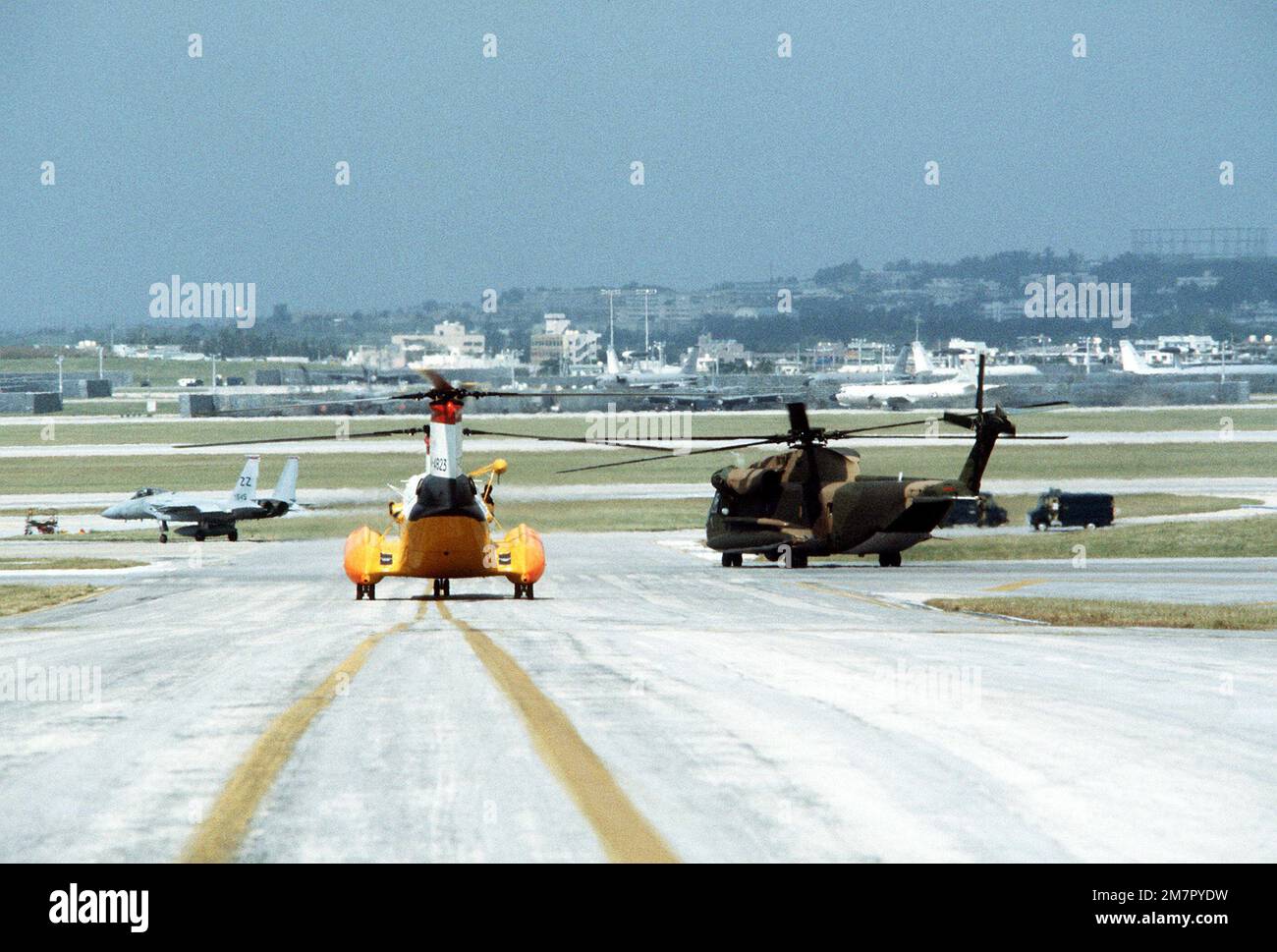 A view of an H-46 helicopter, an HH-53 Super Jolly helicopter and an F-15 Eagle aircraft during Operation Cope Angel. Subject Operation/Series: COPE ANGEL Base: Kadena Air Base State: Okinawa Country: Japan (JPN) Stock Photo