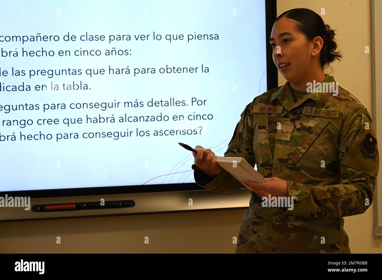 U.S. Air Force Airman 1st Class Payton Brewer, 517th Training Group Spanish linguist student, delivers information she learned about a fellow classmate as an assignment at the Defense Language Institute Foreign Language Center, Presidio of Monterey, Calif., May 11, 2022. Brewer studies Spanish at the Multi Language School; the Multi Language School teaches a variety of languages less-commonly taught in response to the Department of Defense’s requirements for language capability. Stock Photo