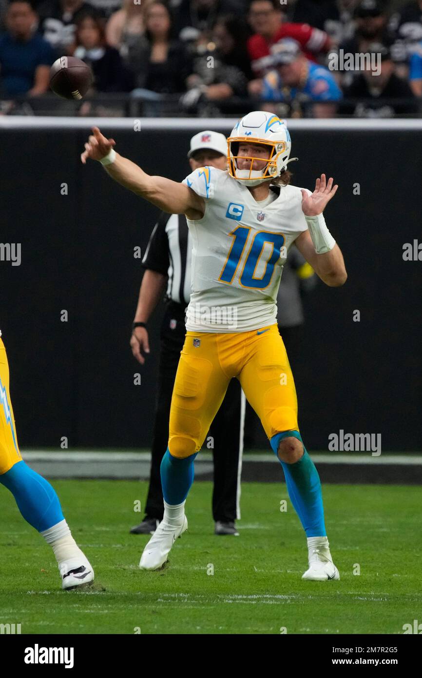 Los Angeles Chargers quarterback Justin Herbert (10) throws the ball  against the Las Vegas Raiders during the first half of an NFL football  game, Sunday, Dec. 4, 2022, in Las Vegas. (AP