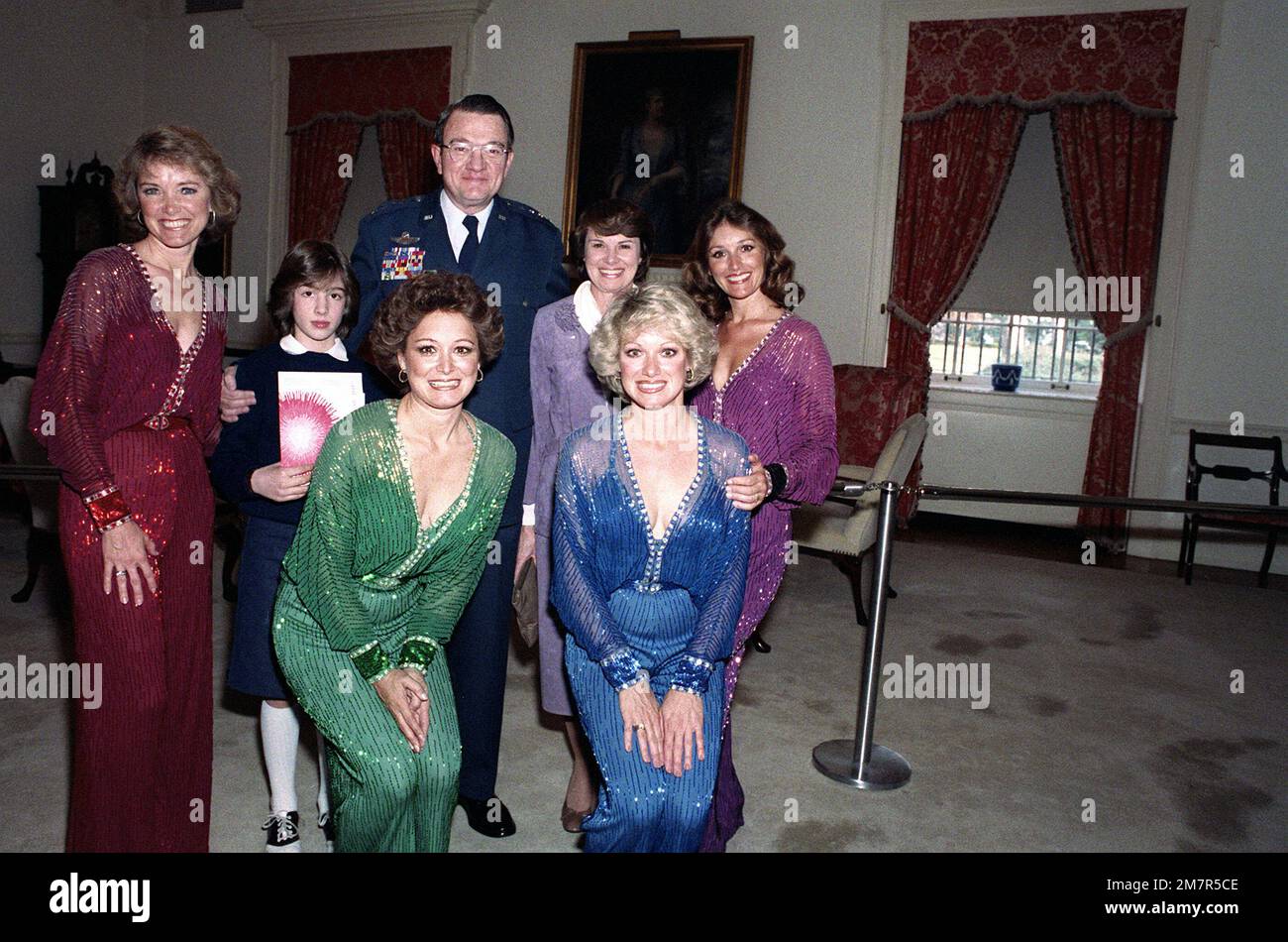 GEN Robert Mathis, his wife and daughter, in white collars, pose with the Lennon Sisters. The Lennon Sisters are taking part in an Air Force Christmas concert at D.A.R. Constitution Hall. Base: Washington State: District Of Columbia (DC) Country: United States Of America (USA) Stock Photo