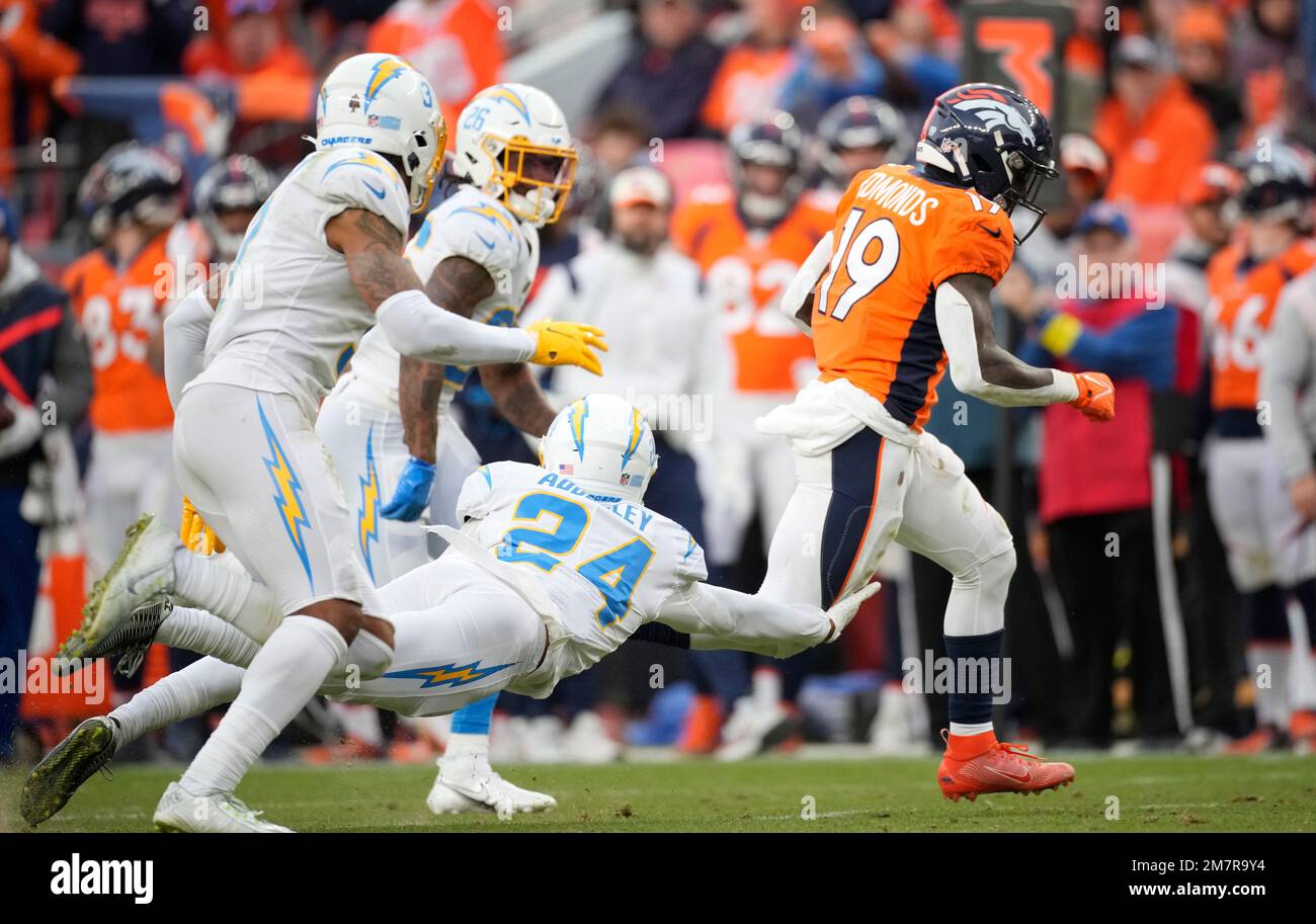 Denver Broncos running back Chase Edmonds (19) runs past Los Angeles