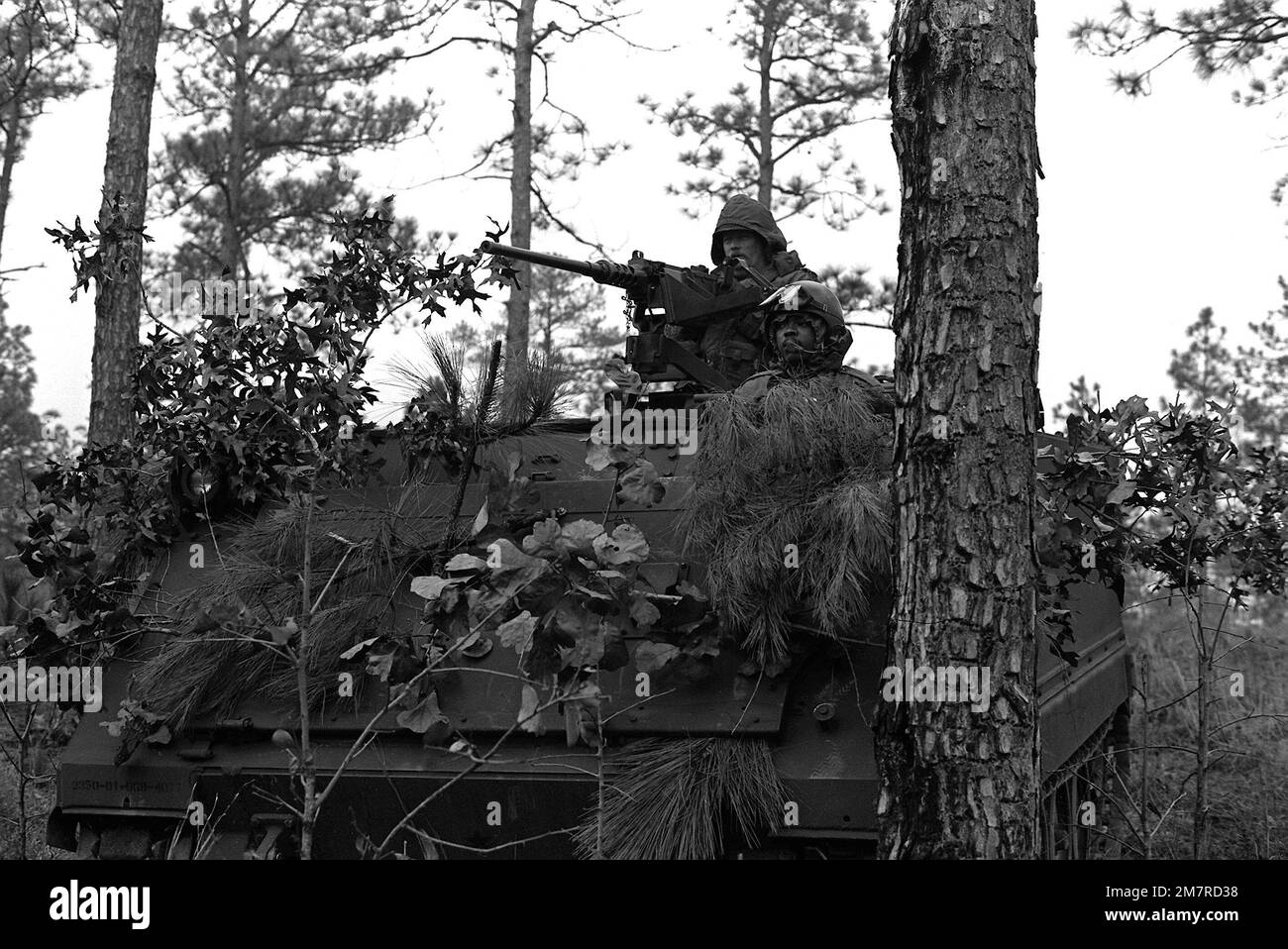 A South Carolina National Guardsman sits in his M-113 armored personnel