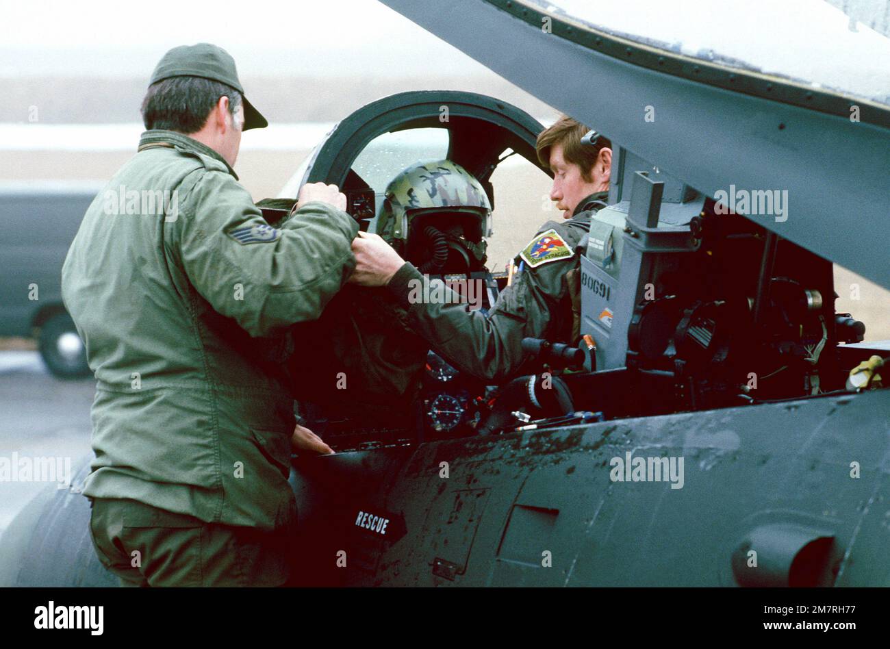 An Air Force Staff SGT helps MAJ Bill Walsch into his A10 Thunderbolt