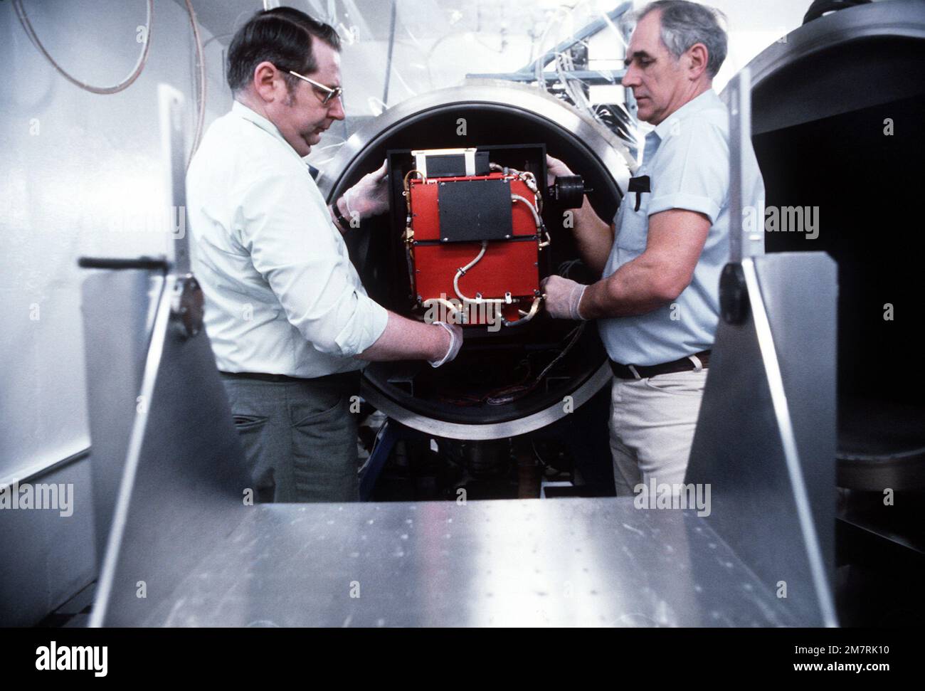 victor-baisley-helps-joe-c-larrabee-place-a-space-photometer-in-a