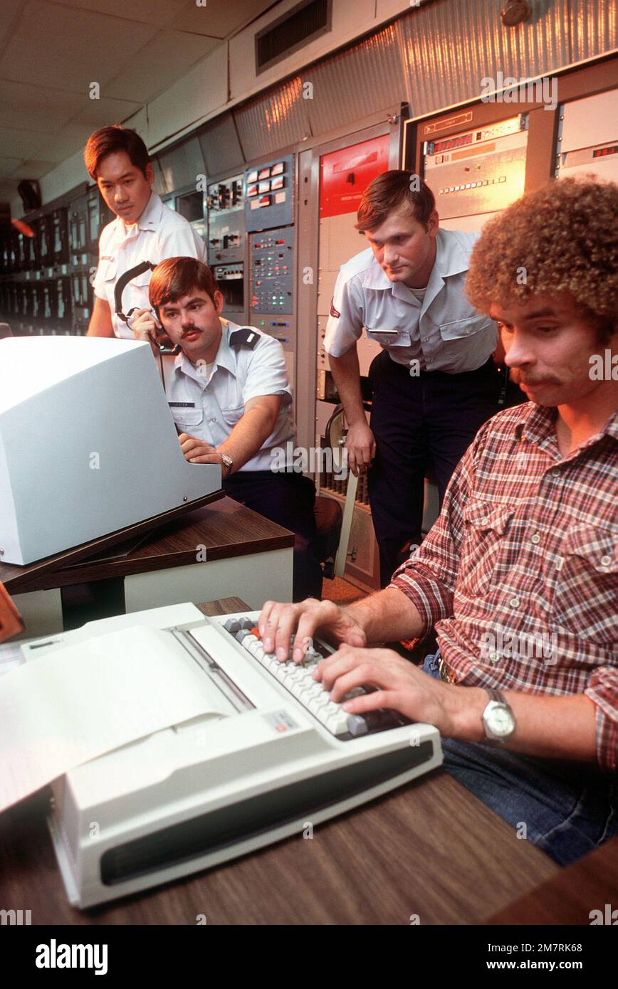 Technicians operate a computer terminal at the Rocket Propulsion Lab ...