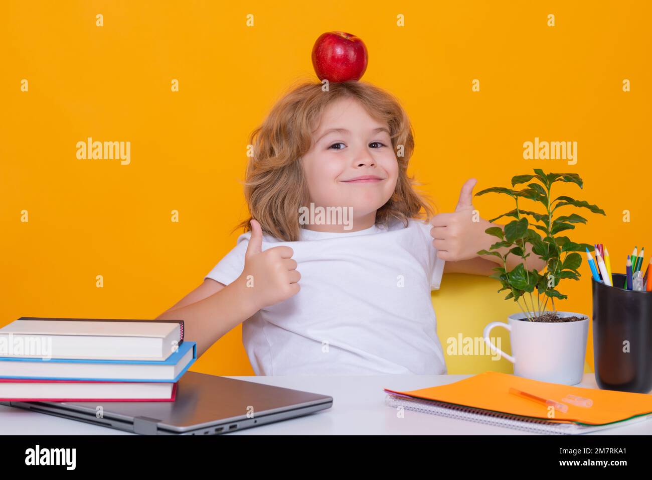 Funny pupil. Nerd school kid isolated on studio background. Clever child from elementary school with book. Smart genius intelligence kid ready to Stock Photo